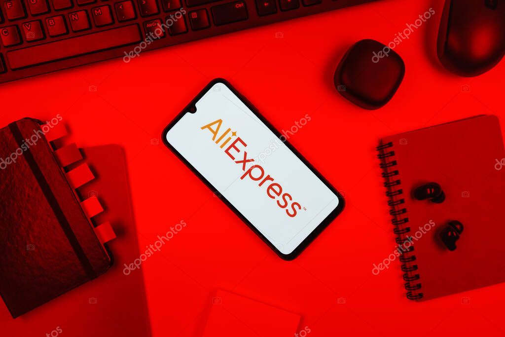 Prague, Czechia - 10 21 2024: Smartphone on surface showing AliExpress logo.