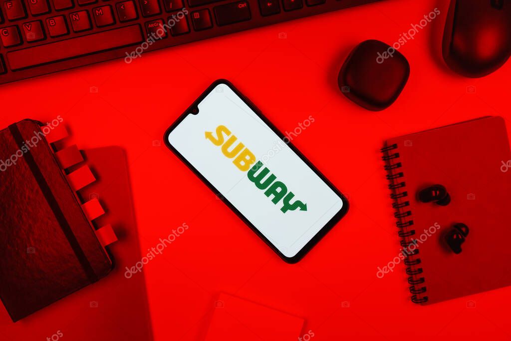 Prague, Czechia - 10 21 2024: Smartphone on surface showing Subway logo.