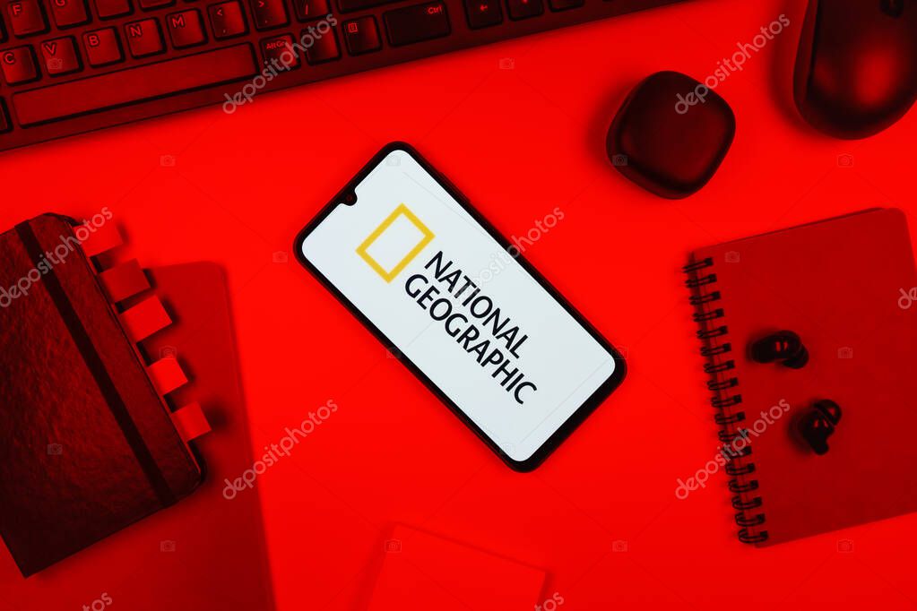 Prague, Czechia - 10 21 2024: Smartphone on surface showing National Geographic logo.