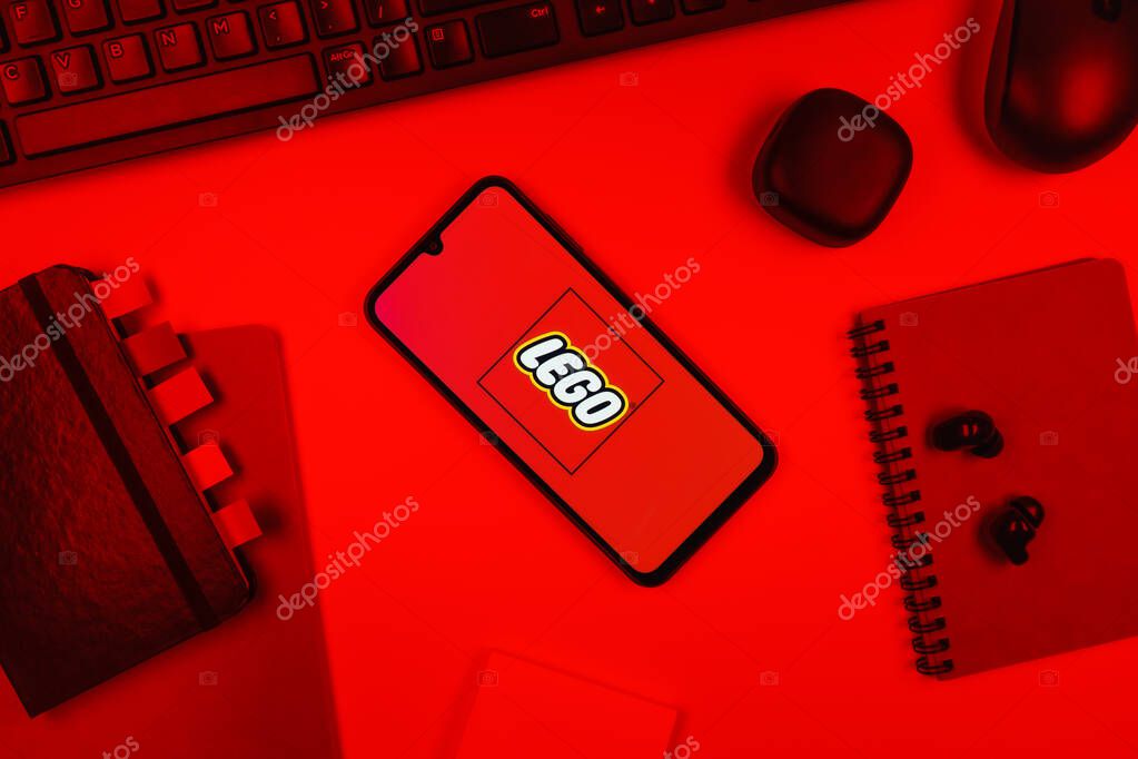 Prague, Czechia - 10 21 2024: Smartphone on surface showing Lego logo.