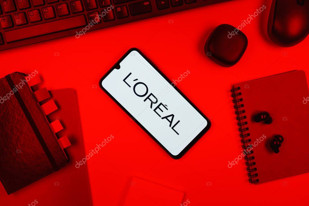 Prague, Czechia - 10 21 2024: Smartphone on surface showing L'Oreal logo.