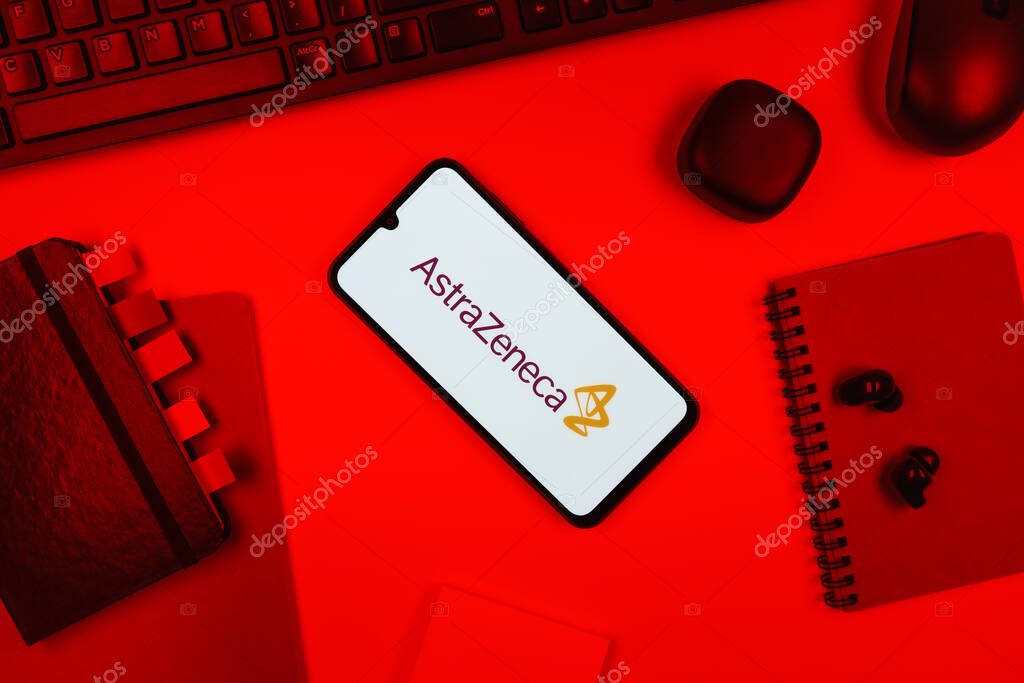 Prague, Czechia - 10 21 2024: Smartphone on surface showing AstraZeneca logo.