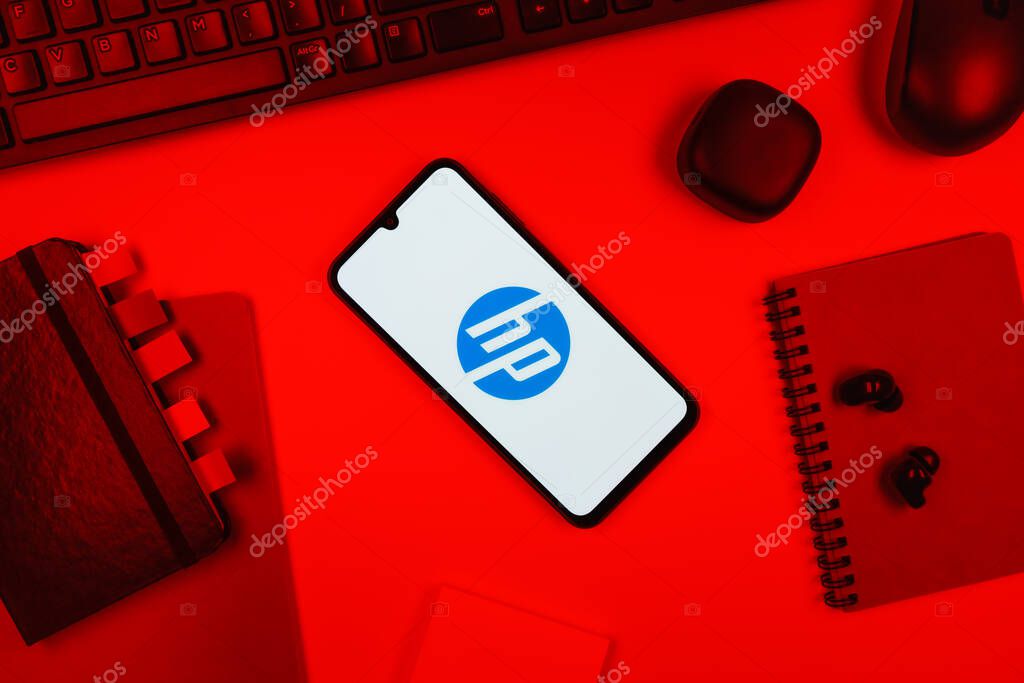Prague, Czechia - 10 21 2024: Smartphone on surface showing Hewlett-Packard logo.