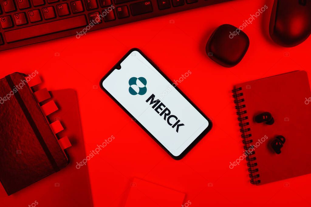 Prague, Czechia - 10 21 2024: Smartphone on surface showing Merck logo.