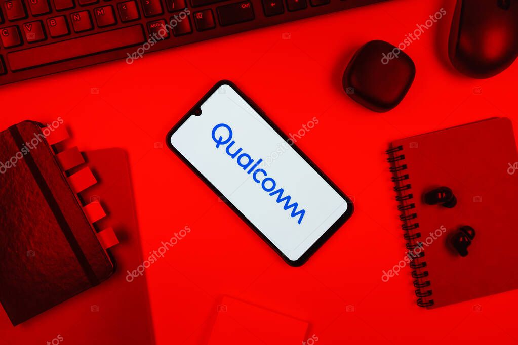 Prague, Czechia - 10 21 2024: Smartphone on surface showing Qualcomm logo.