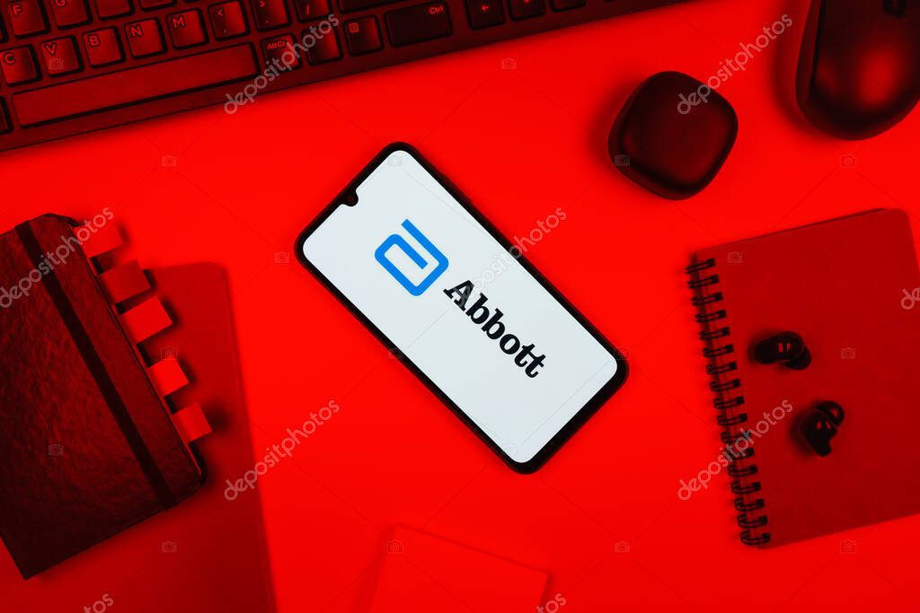 Prague, Czechia - 10 21 2024: Smartphone on surface showing Abbott Laboratories logo.