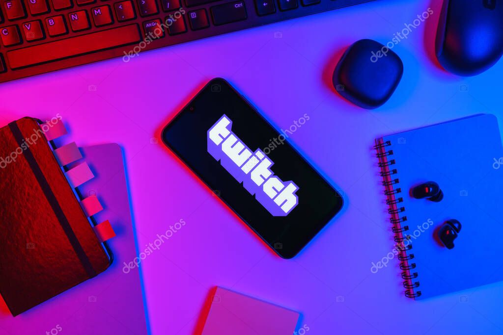 Prague, Czechia - 10 21 2024: Smartphone on surface showing Twitch logo.