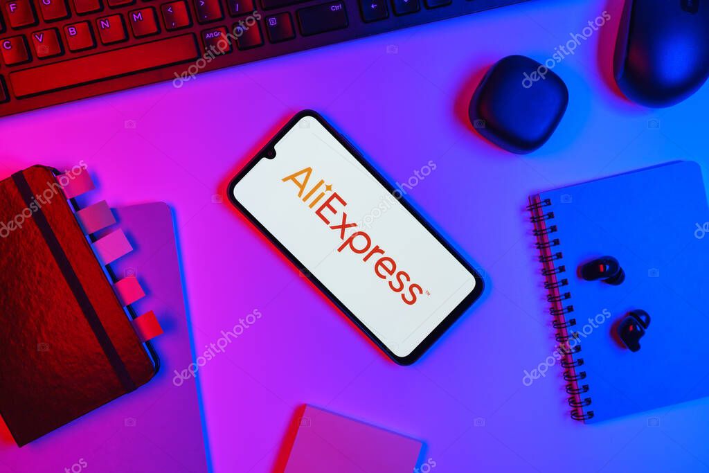 Prague, Czechia - 10 21 2024: Smartphone on surface showing AliExpress logo.