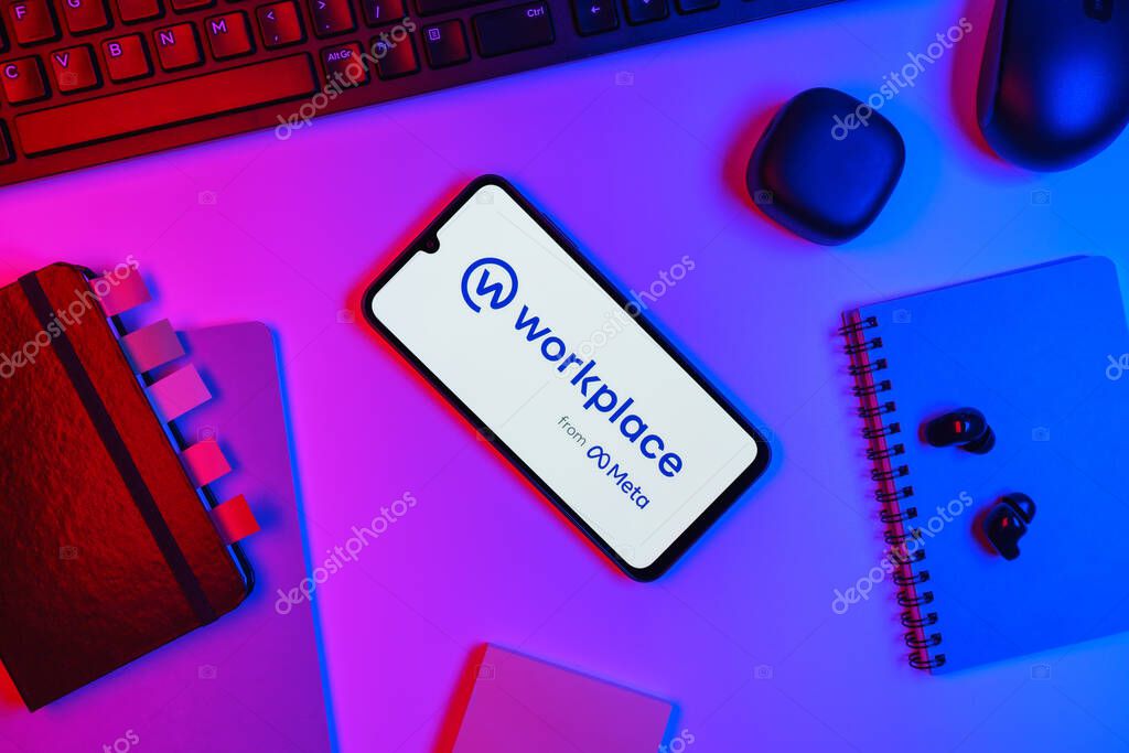 Prague, Czechia - 10 21 2024: Smartphone on surface showing Workplace logo.