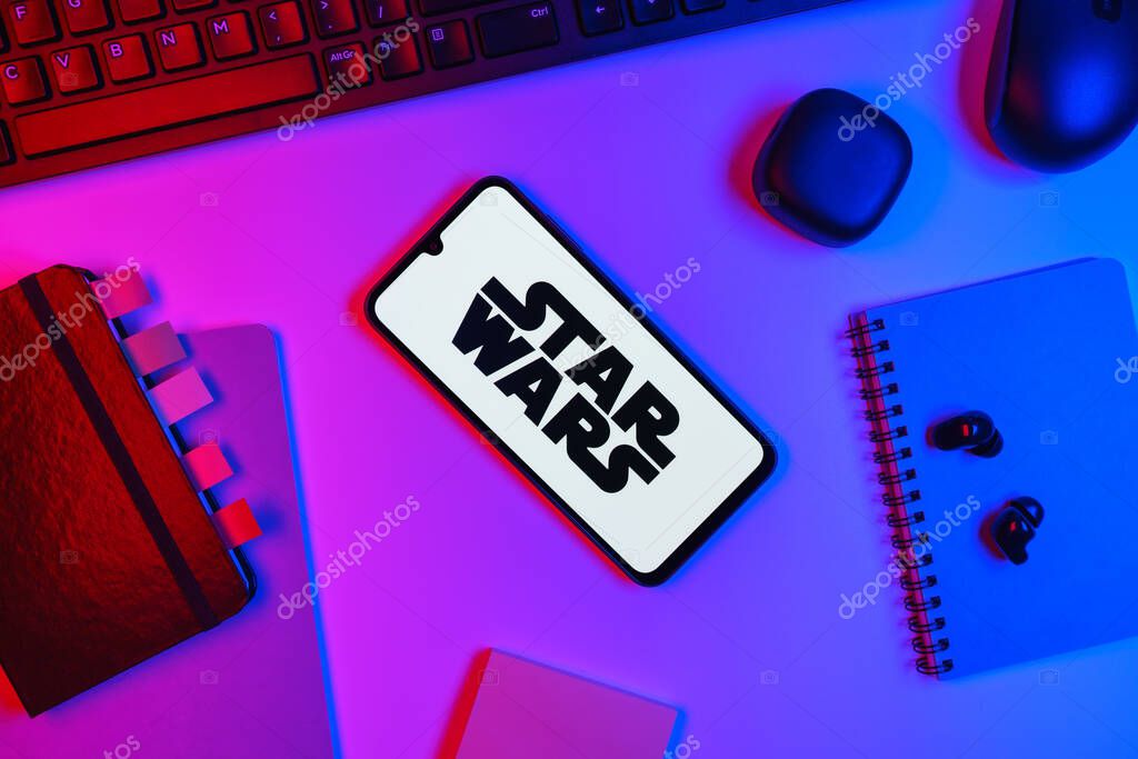 Prague, Czechia - 10 21 2024: Smartphone on surface showing Star Wars logo.