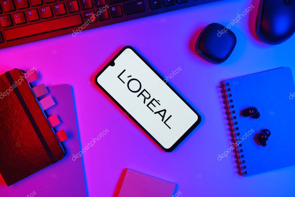 Prague, Czechia - 10 21 2024: Smartphone on surface showing L'Oreal logo.
