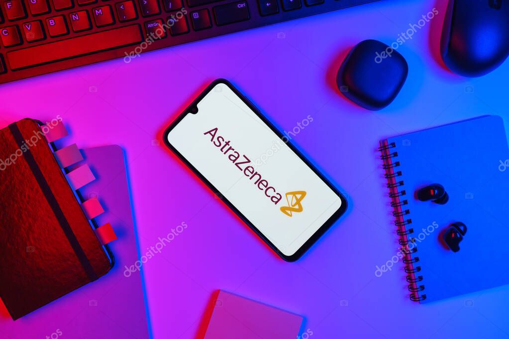 Prague, Czechia - 10 21 2024: Smartphone on surface showing AstraZeneca logo.