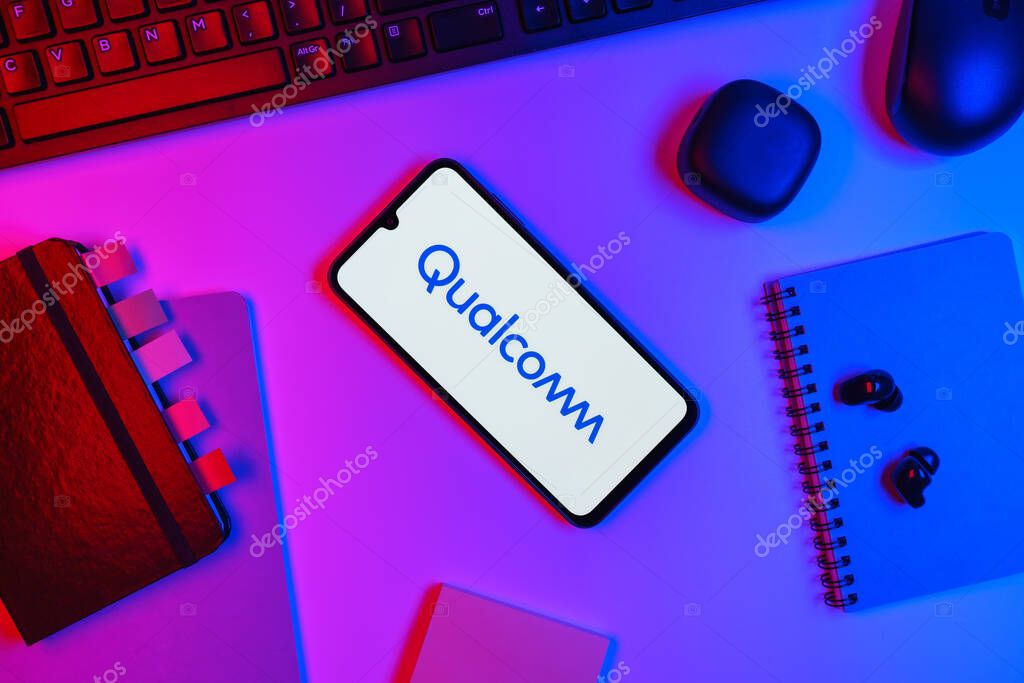 Prague, Czechia - 10 21 2024: Smartphone on surface showing Qualcomm logo.