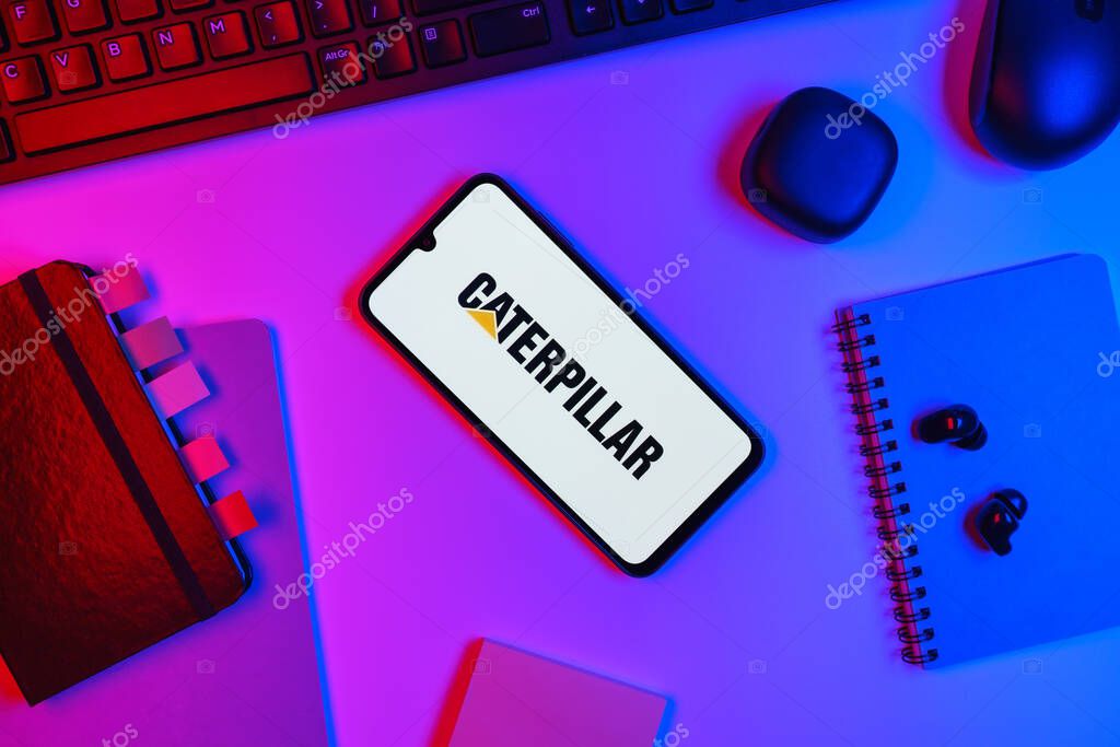 Prague, Czechia - 10 21 2024: Smartphone on surface showing Caterpillar logo.