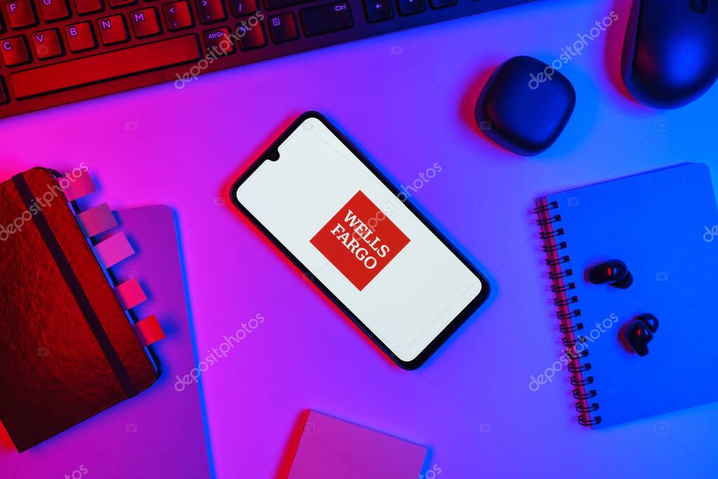 Prague, Czechia - 10 21 2024: Smartphone on surface showing Wells Fargo logo.