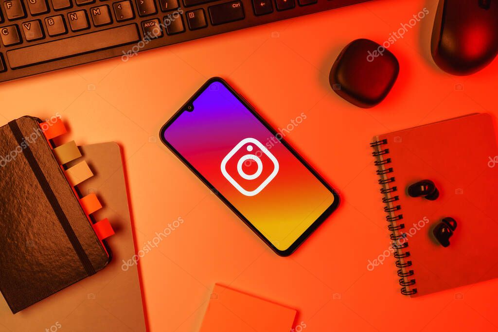 Prague, Czechia - 10 21 2024: Smartphone on surface showing Instagram logo.
