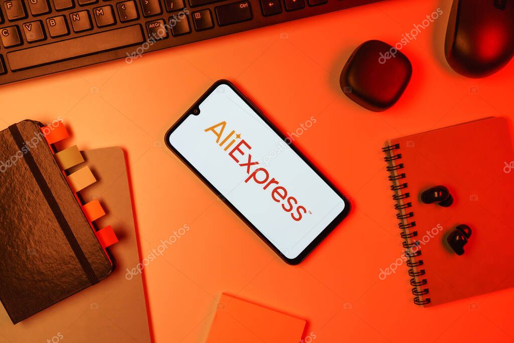 Prague, Czechia - 10 21 2024: Smartphone on surface showing AliExpress logo.