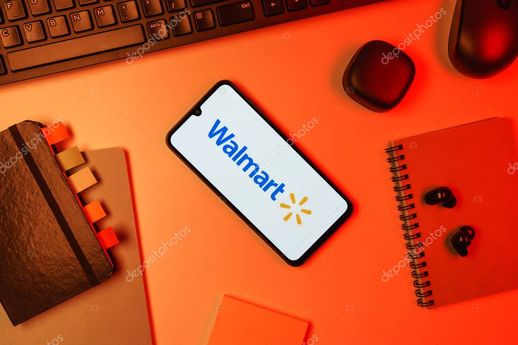 Prague, Czechia - 10 21 2024: Smartphone on surface showing Walmart logo.
