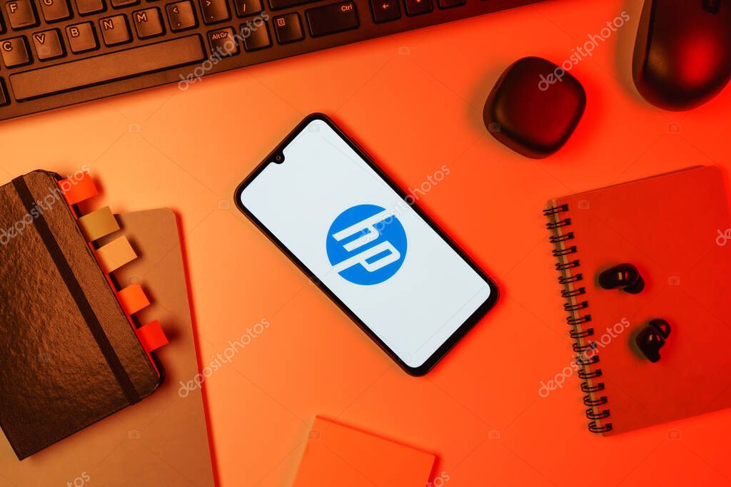 Prague, Czechia - 10 21 2024: Smartphone on surface showing Hewlett-Packard logo.