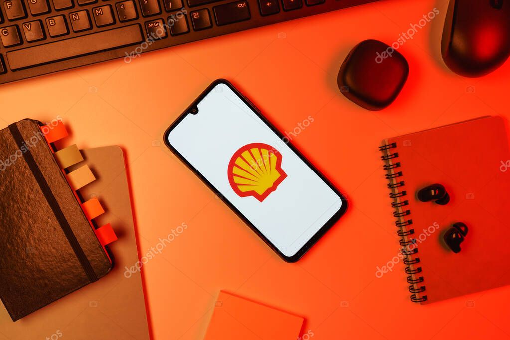 Prague, Czechia - 10 21 2024: Smartphone on surface showing Shell logo.
