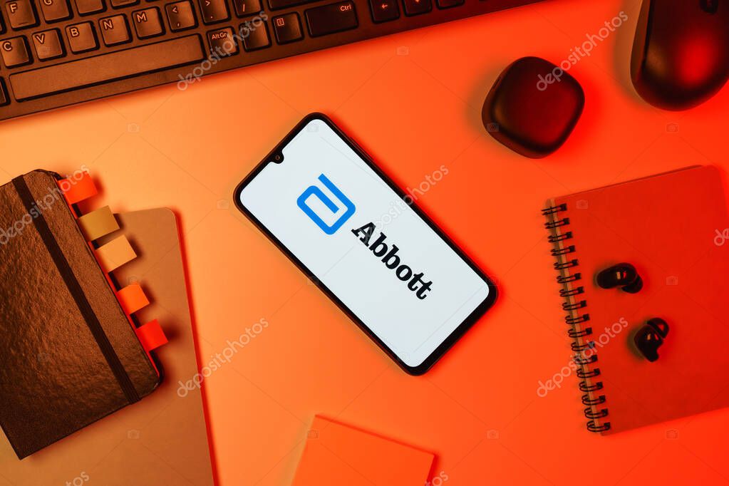 Prague, Czechia - 10 21 2024: Smartphone on surface showing Abbott Laboratories logo.