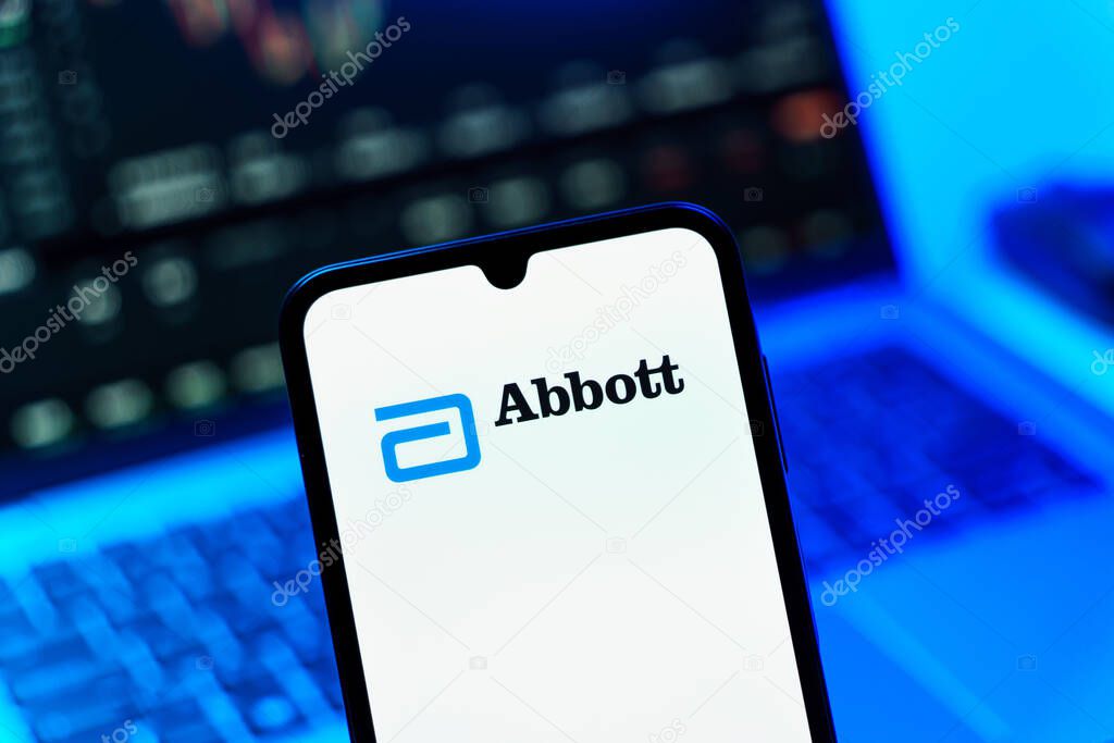 Prague, Czechia - 10 21 2024: Smartphone on surface showing Abbott Laboratories logo.
