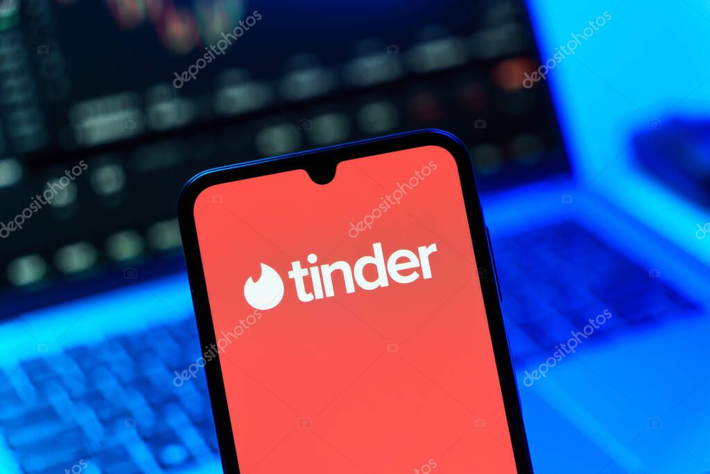 Prague, Czechia - 10 21 2024: Smartphone on surface showing Tinder logo.