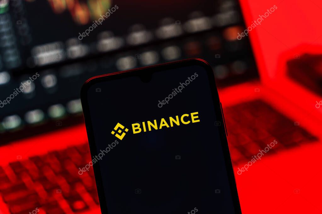 Prague, Czechia - 10 21 2024: Smartphone on surface showing Binance logo.
