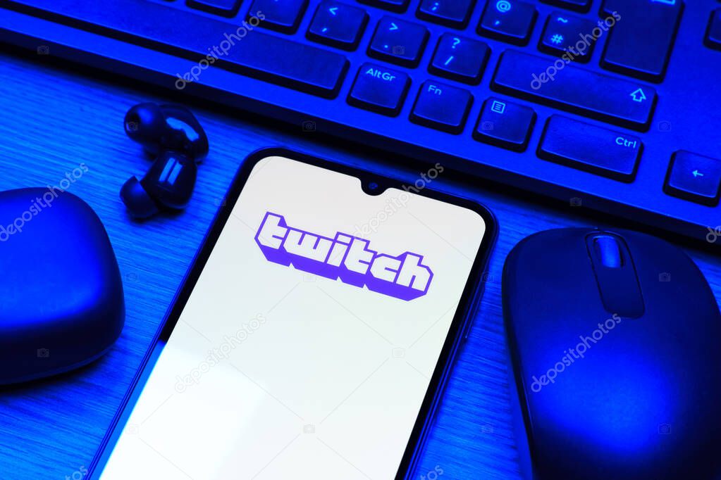 Prague, Czechia - 10 21 2024: Smartphone on surface showing Twitch logo.