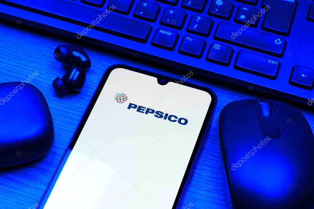 Prague, Czechia - 10 21 2024: Smartphone on surface showing Pepsico logo.