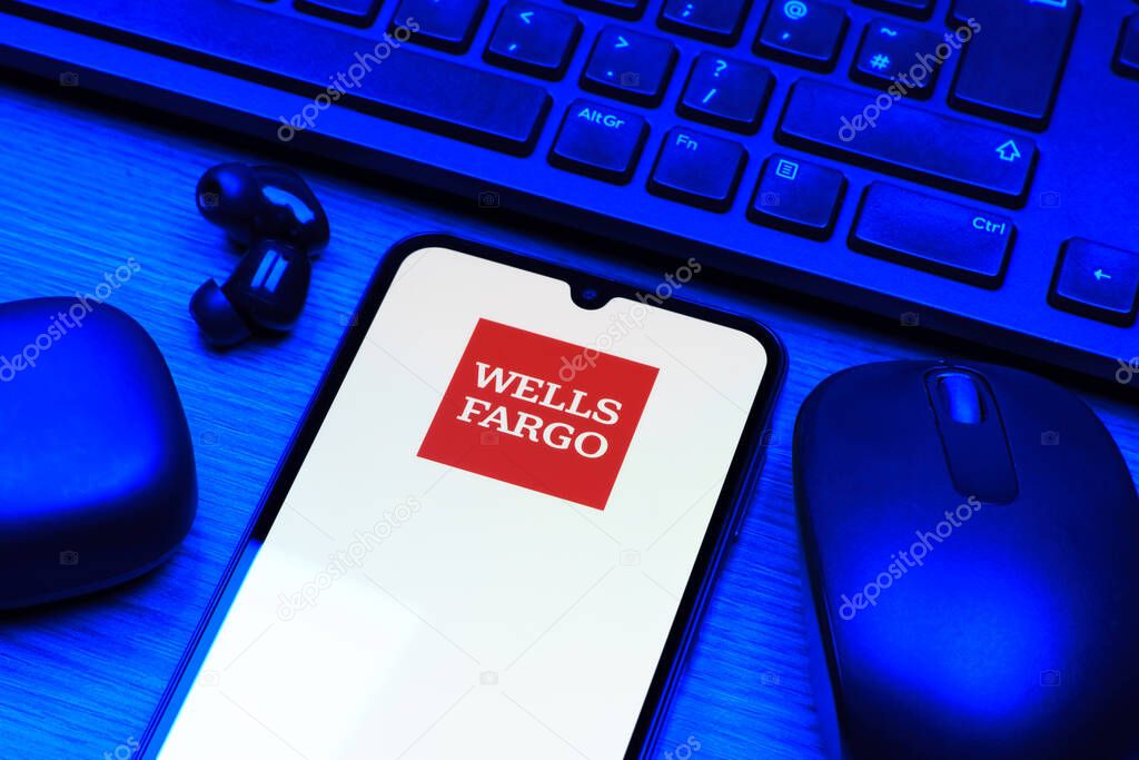 Prague, Czechia - 10 21 2024: Smartphone on surface showing Wells Fargo logo.