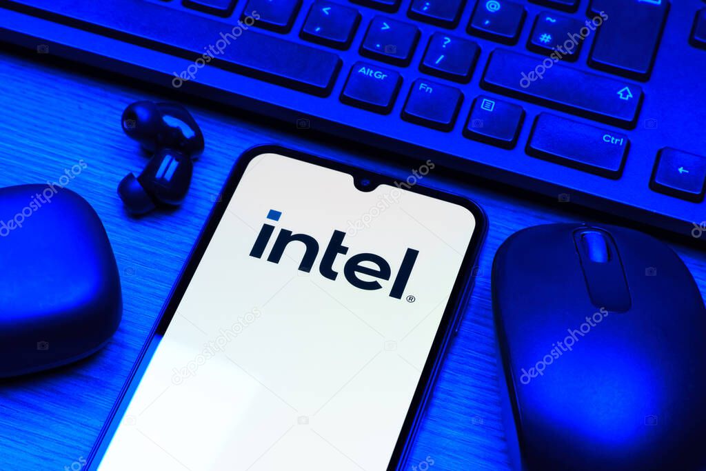Prague, Czechia - 10 21 2024: Smartphone on surface showing Intel logo.