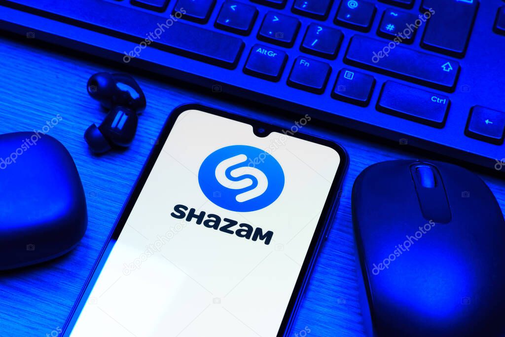 Prague, Czechia - 10 21 2024: Smartphone on surface showing Shazam logo.