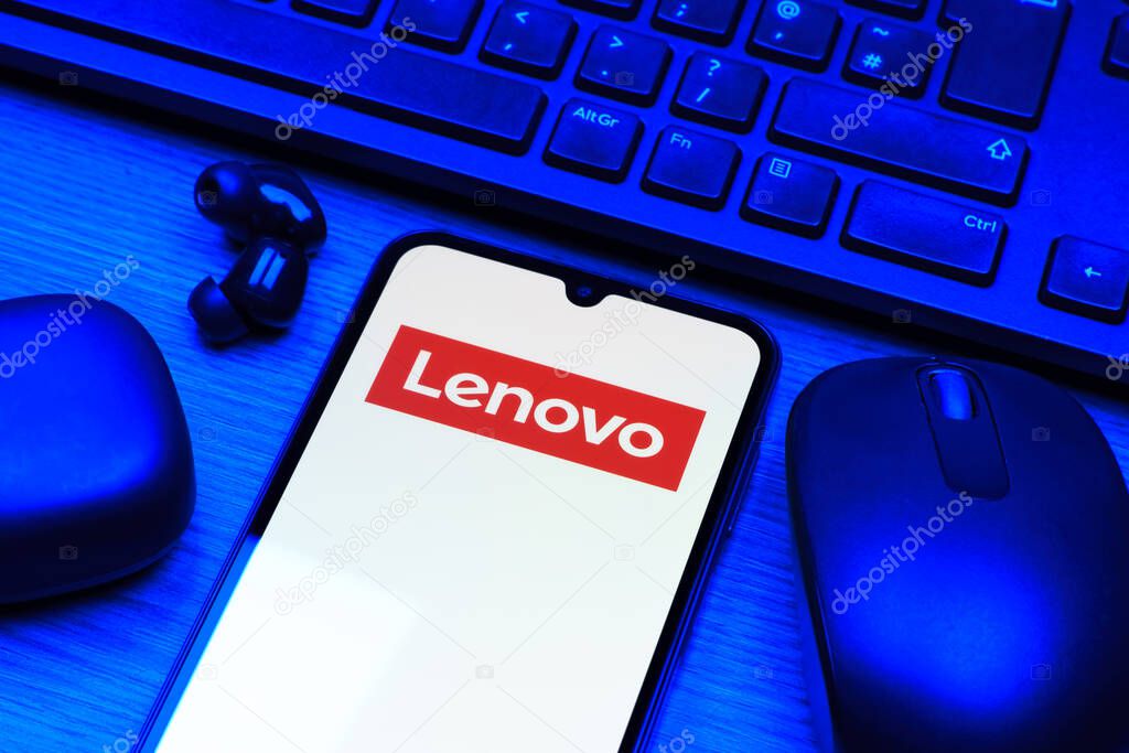 Prague, Czechia - 10 21 2024: Smartphone on surface showing Lenovo logo.