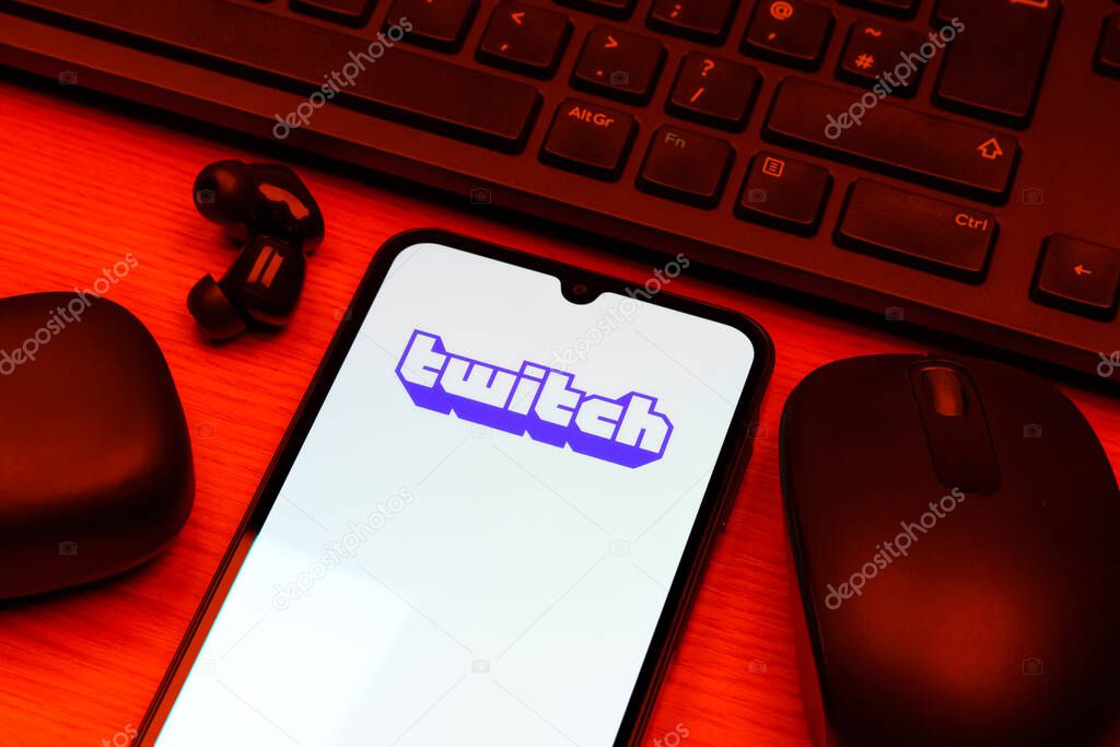 Prague, Czechia - 10 21 2024: Smartphone on surface showing Twitch logo.