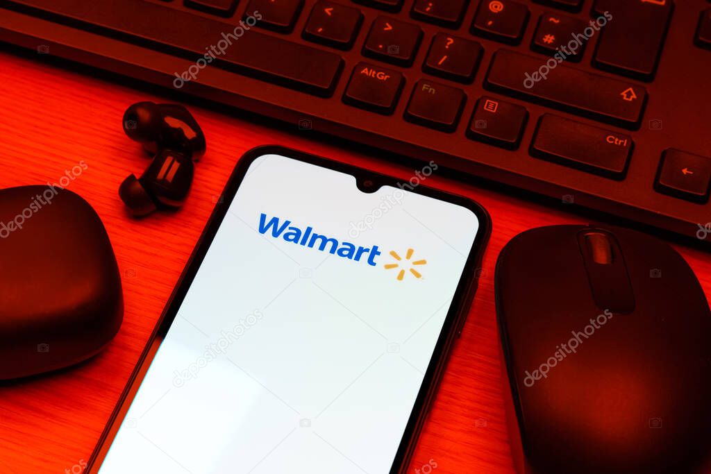 Prague, Czechia - 10 21 2024: Smartphone on surface showing Walmart logo.