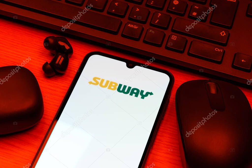 Prague, Czechia - 10 21 2024: Smartphone on surface showing Subway logo.