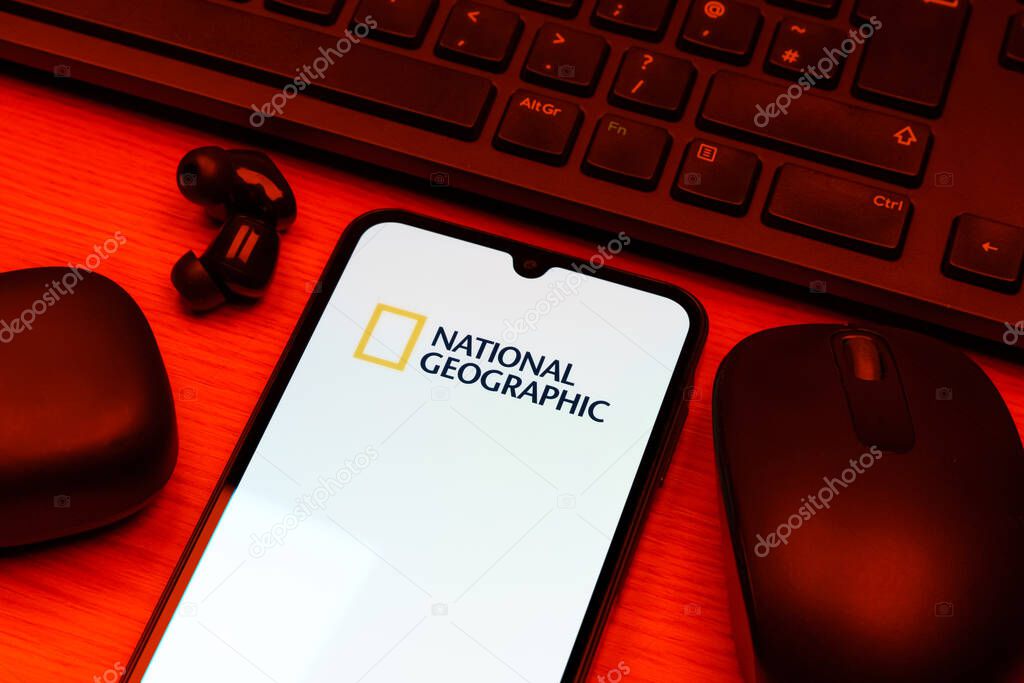 Prague, Czechia - 10 21 2024: Smartphone on surface showing National Geographic logo.