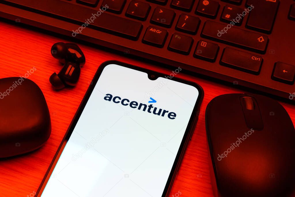 Prague, Czechia - 10 21 2024: Smartphone on surface showing Accenture logo.