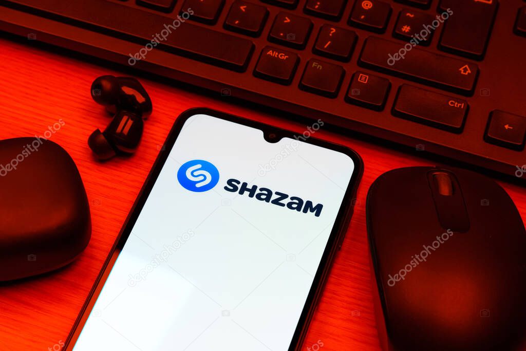 Prague, Czechia - 10 21 2024: Smartphone on surface showing Shazam logo.