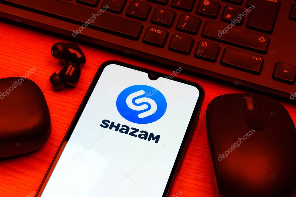 Prague, Czechia - 10 21 2024: Smartphone on surface showing Shazam logo.