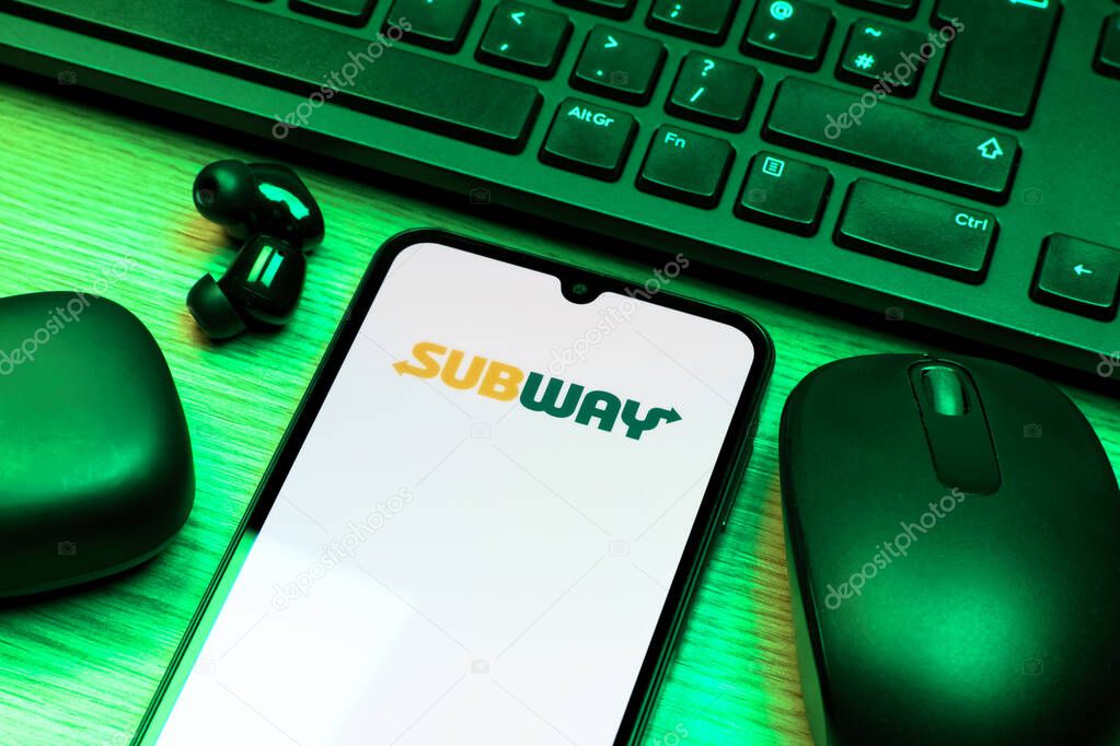 Prague, Czechia - 10 21 2024: Smartphone on surface showing Subway logo.