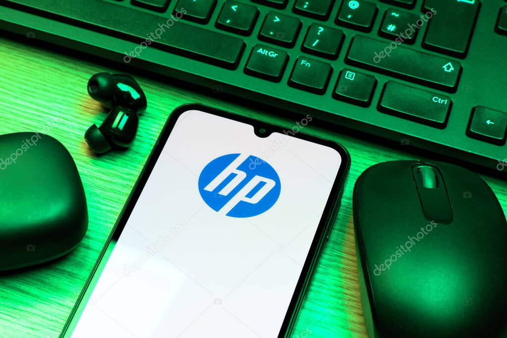 Prague, Czechia - 10 21 2024: Smartphone on surface showing Hewlett-Packard logo.