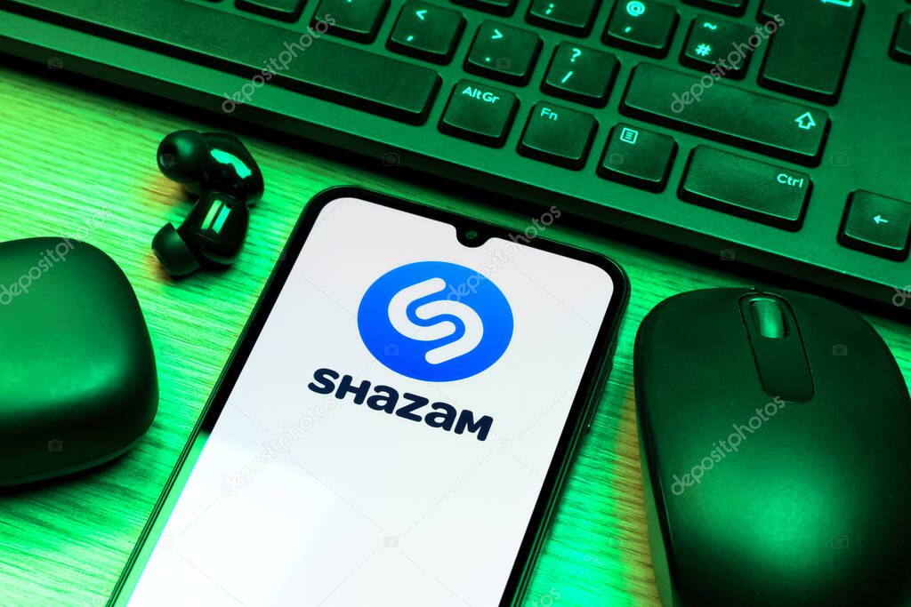 Prague, Czechia - 10 21 2024: Smartphone on surface showing Shazam logo.