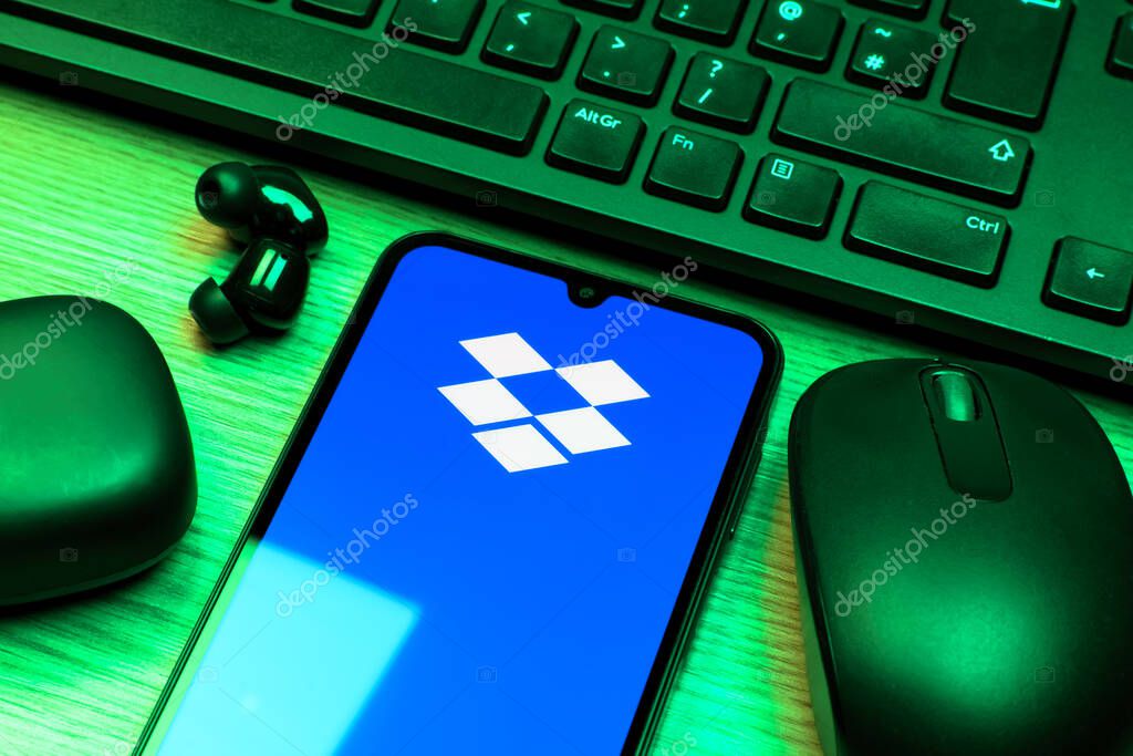 Prague, Czechia - 10 21 2024: Smartphone on surface showing Dropbox logo.