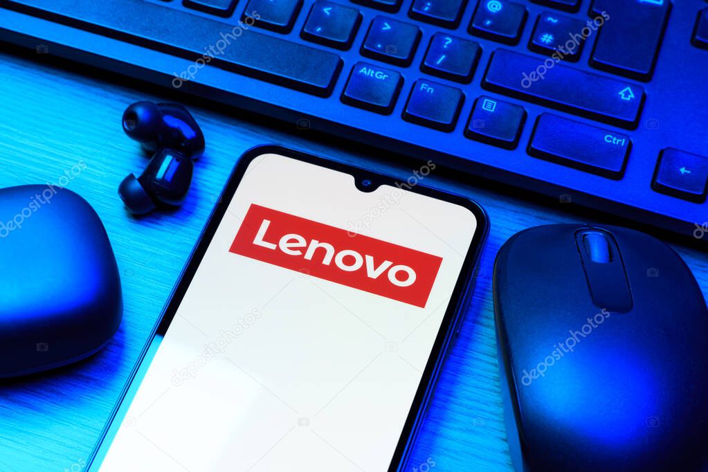 Prague, Czechia - 10 21 2024: Smartphone on surface showing Lenovo logo.