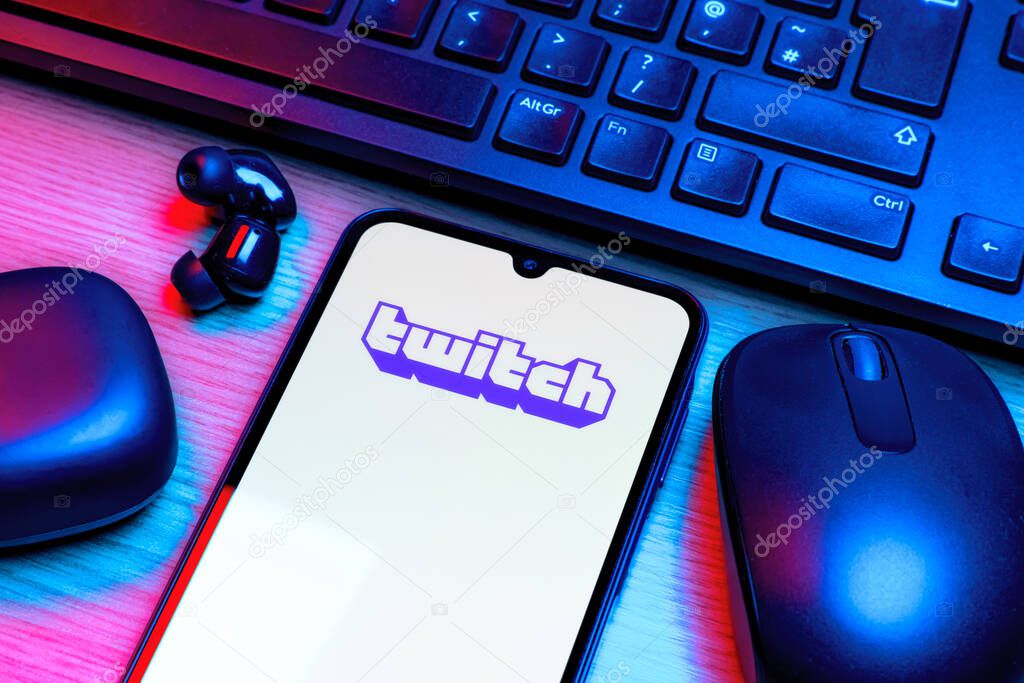 Prague, Czechia - 10 21 2024: Smartphone on surface showing Twitch logo.