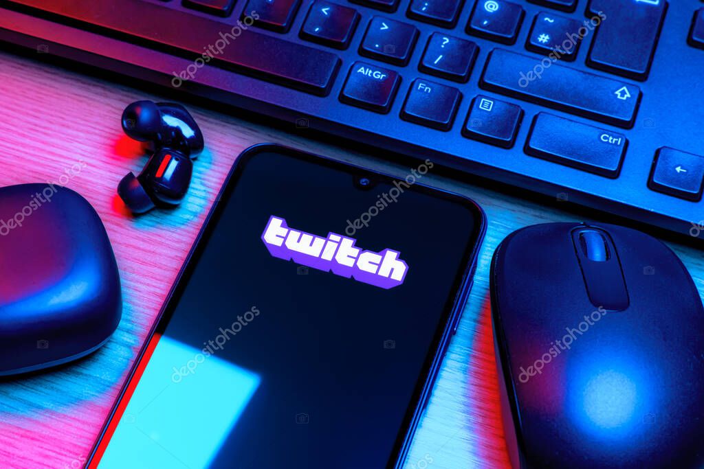 Prague, Czechia - 10 21 2024: Smartphone on surface showing Twitch logo.