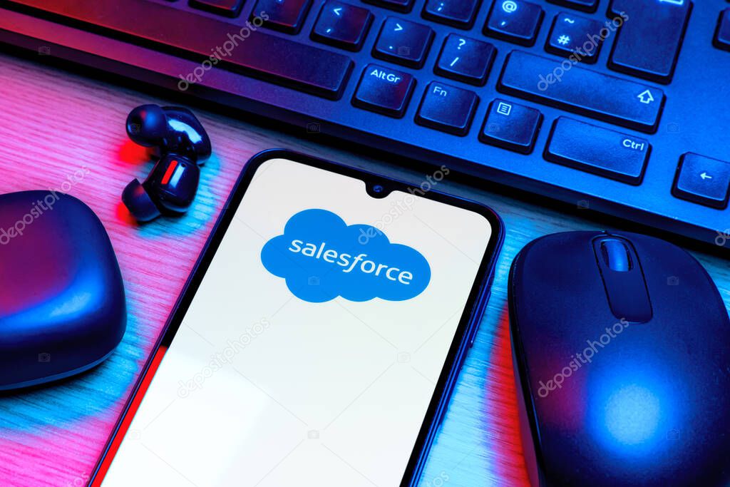 Prague, Czechia - 10 21 2024: Smartphone on surface showing Salesforce logo.