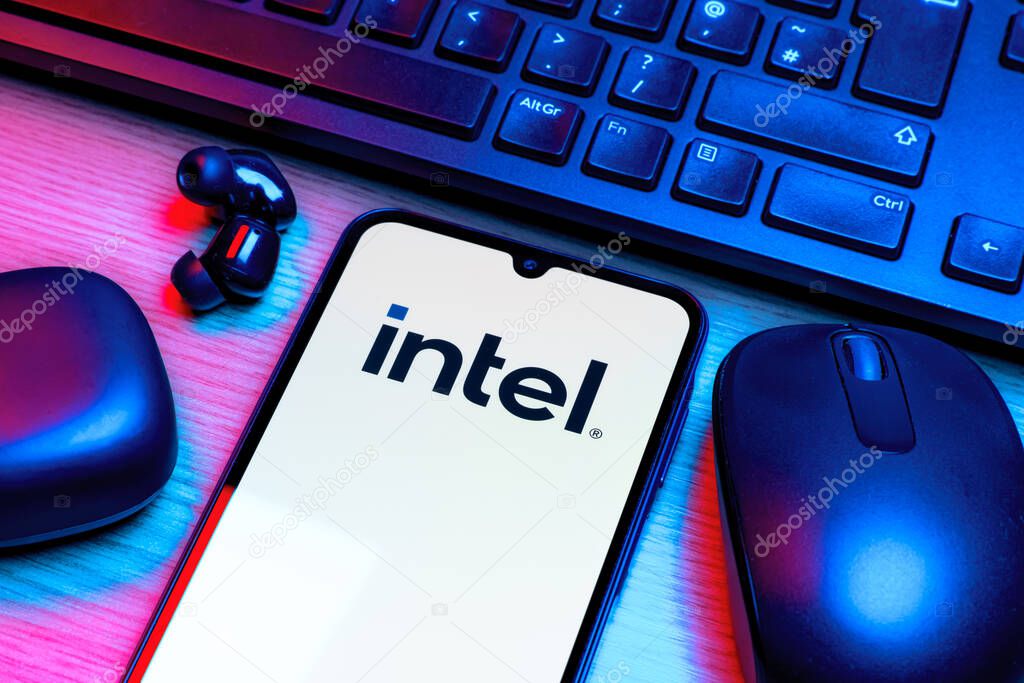 Prague, Czechia - 10 21 2024: Smartphone on surface showing Intel logo.